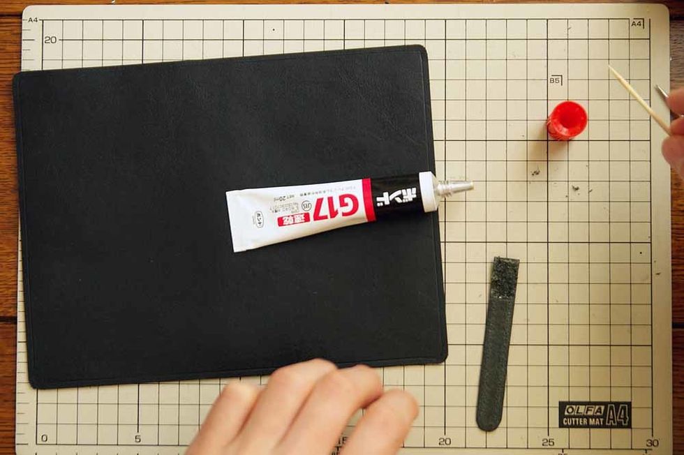Glue the belt together using elastomeric adhesive which is used to glue leather.