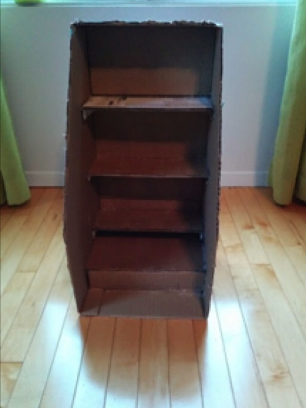 Glue the bottom shelf 5.5cm from the base of the box, then add a piece of cardboard between the bottom shelf and the base.