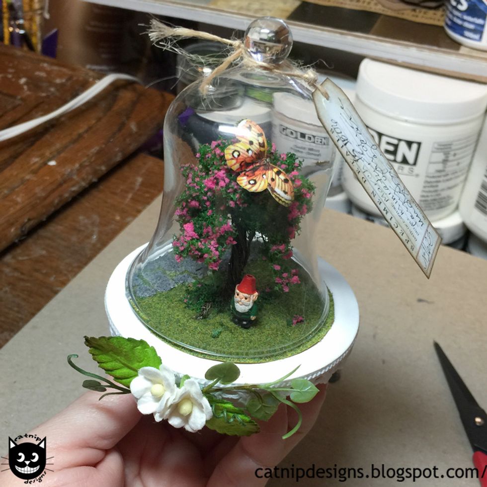 Glue the butterfly to the tree and tie the specimen tag to the knob on the top of the dome. Tah-Da! All done :)