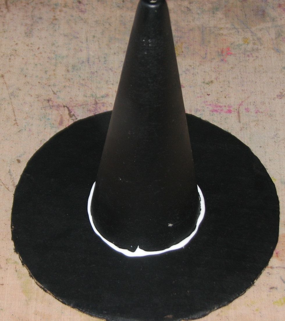 Glue the cone to the center of the circle using your favorite liquid glue.  I used Aleene's Tacky Glue.  If you're in a hurry you could use a hot glue gun.