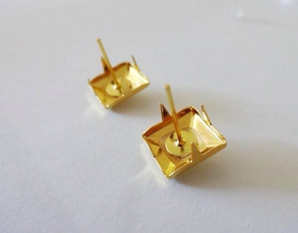 Glue the earring post to the centre of the stud. Hold in place for 30 seconds while the glue sets. Be careful not to burn yourself or stick your fingers together.