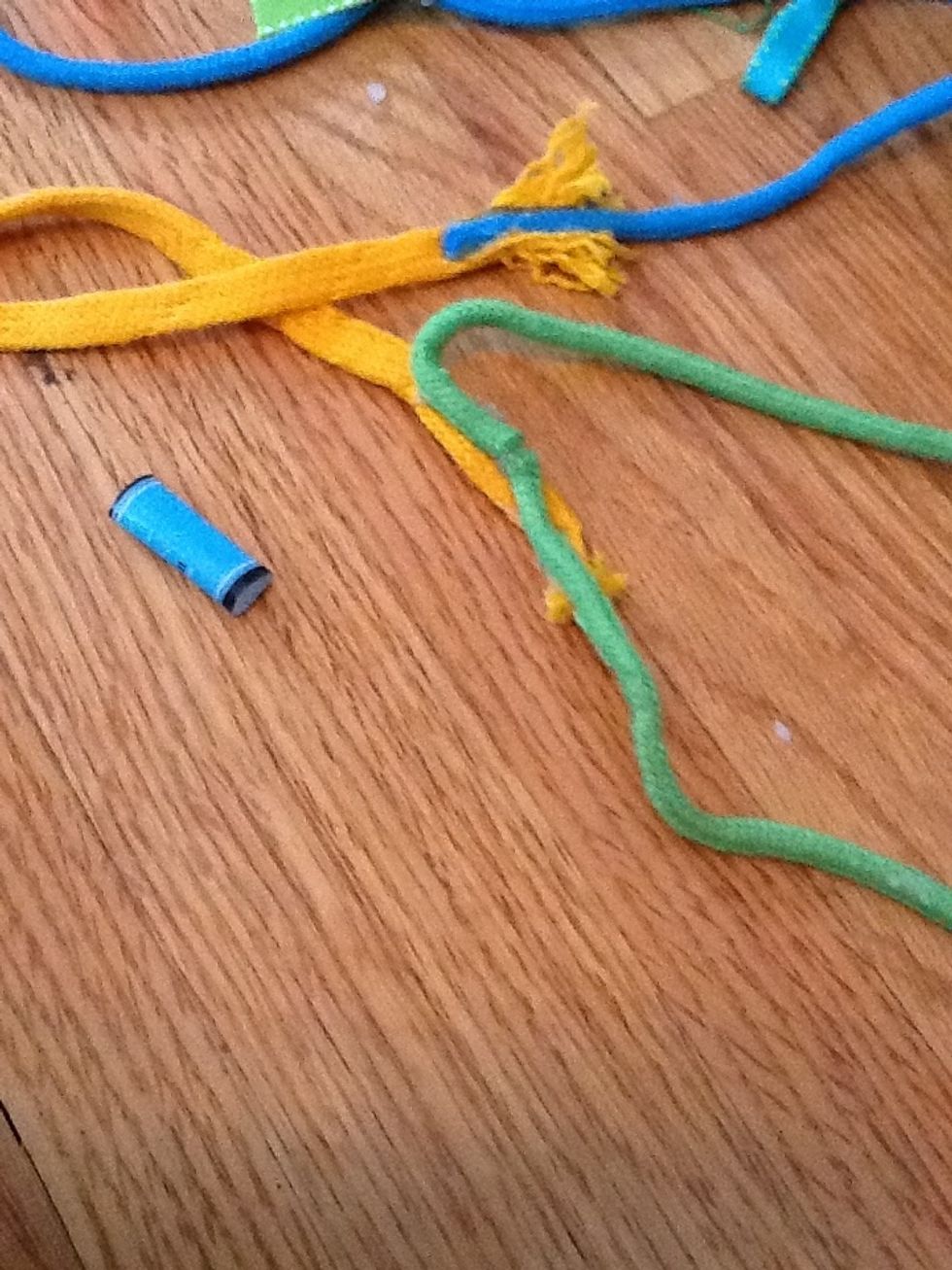 Glue the end of one shoelace to the middle shoelace like so, then take the other end (where the middle and other shoelace combine)