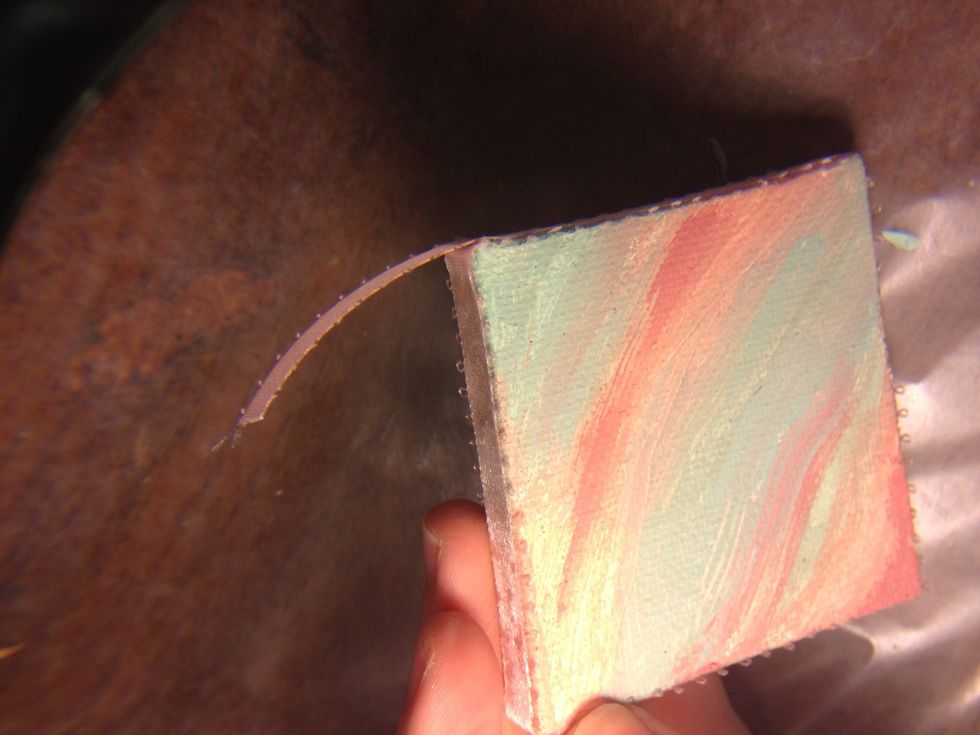 Glue the end on top of your beginning end and leave some extra ribbon to glue down so it doesn't end on a corner.