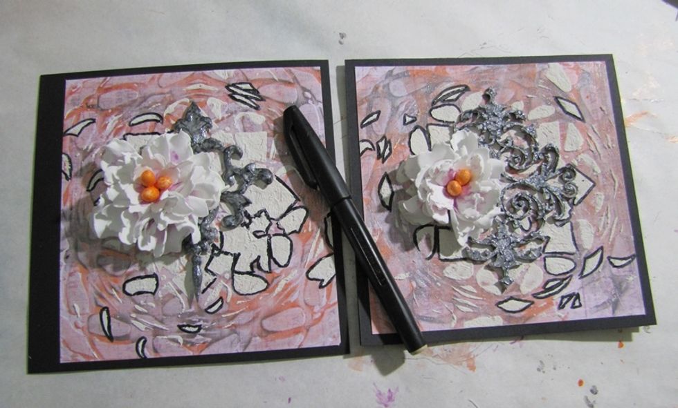 Glue the flowers together, put them on the projects, but don't glue it now. Add some doodling with black pen.