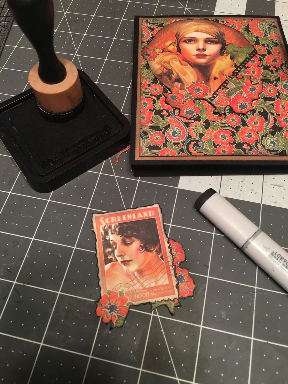 Glue the fussy cut out image to the front of your album as shown. Also cut out the stamp image with the flowers & color the edges.