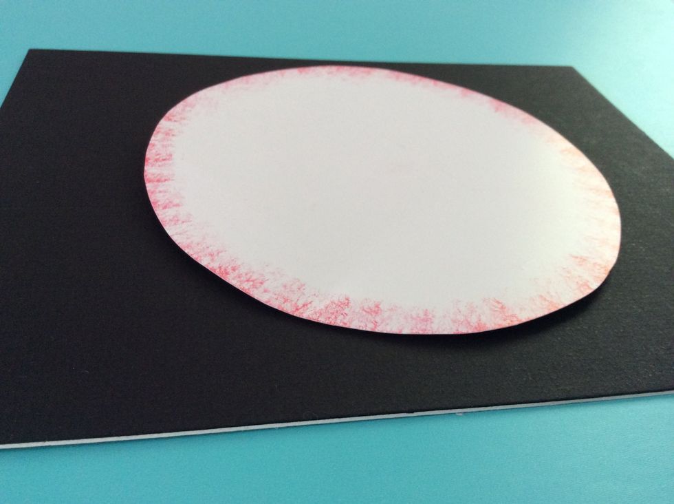 Glue the largest circle on top of the foam board. Make sure it is centered over the small foam square, or the snowman may bend off one side.