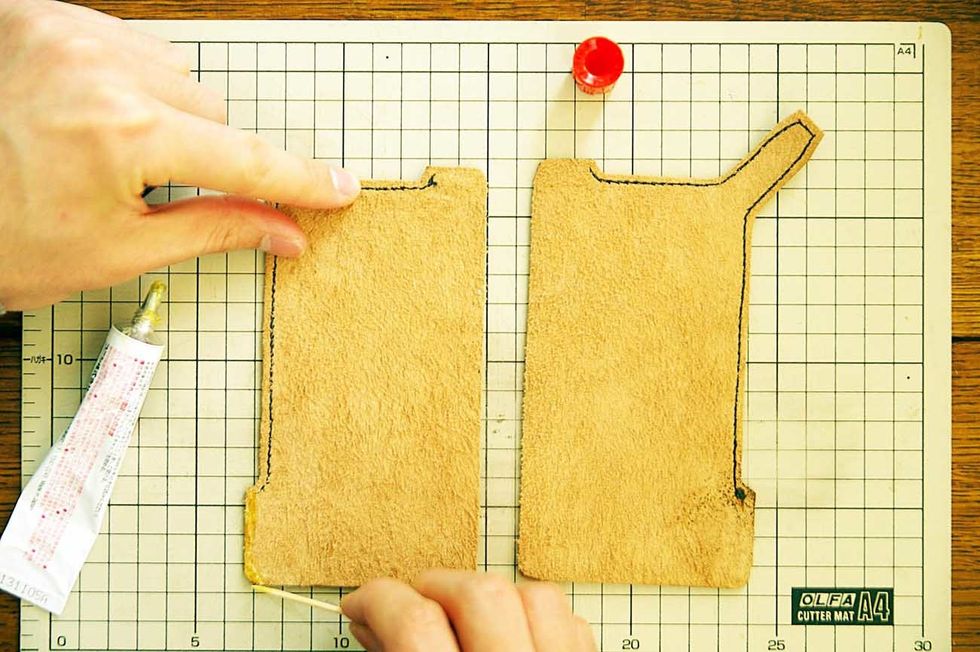 Glue the Leather together using elastomeric adhesive which is used to glue leather.
