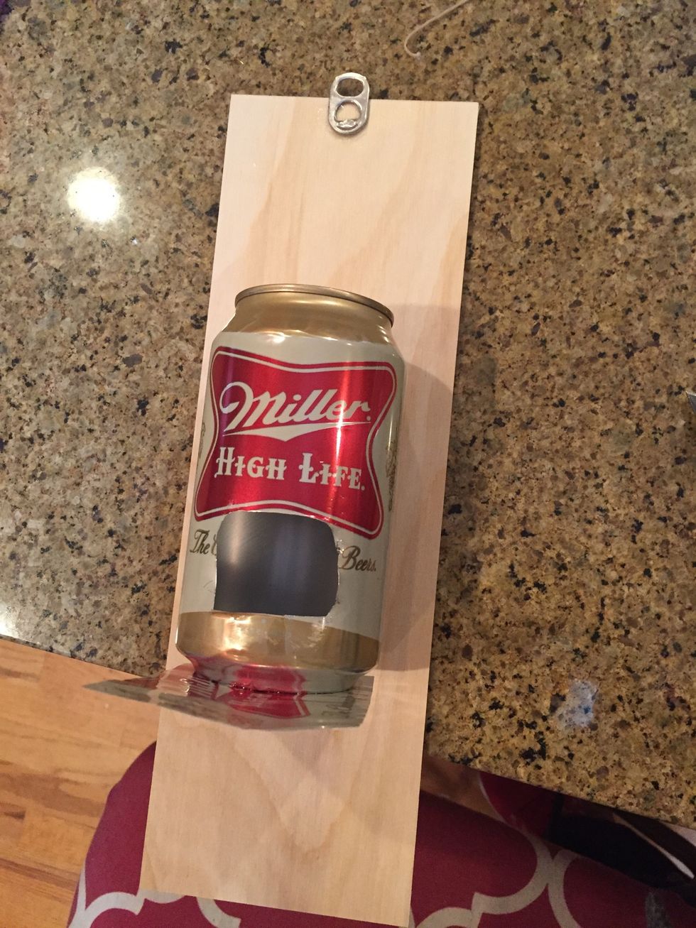 Glue the little can opener piece to the top of the wood board