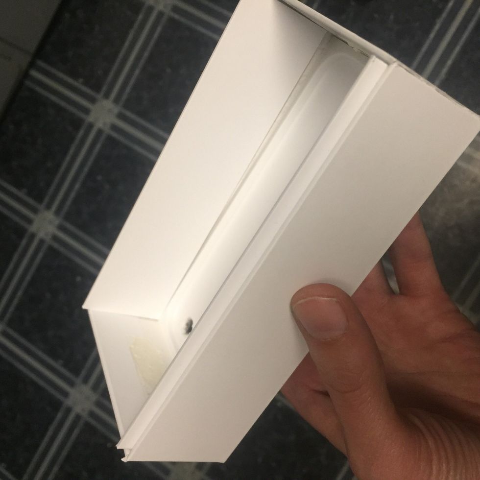 Glue the long side walls in so that the bottom edge of them press down against the plastic tray in the box. These will hold the plastic tray in the box. I just used hot glue for this.