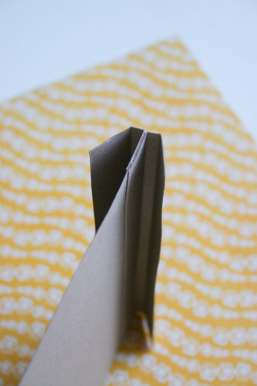 Glue the next piece to the sheet of paper. You need to paste the details from both sides.