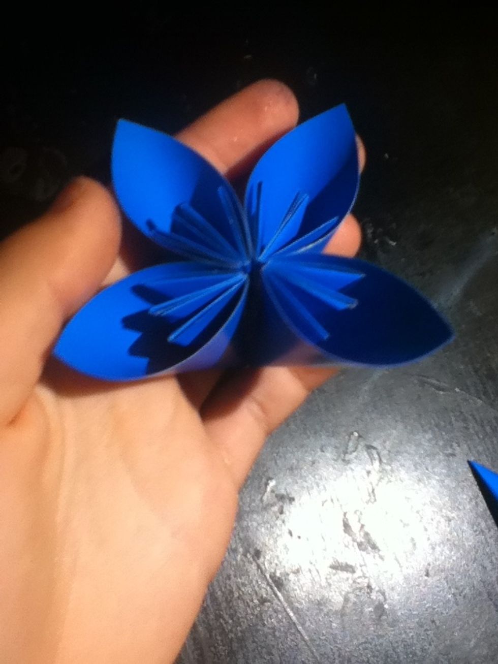 Glue the other pair to the glue strip, to form a cluster of four.