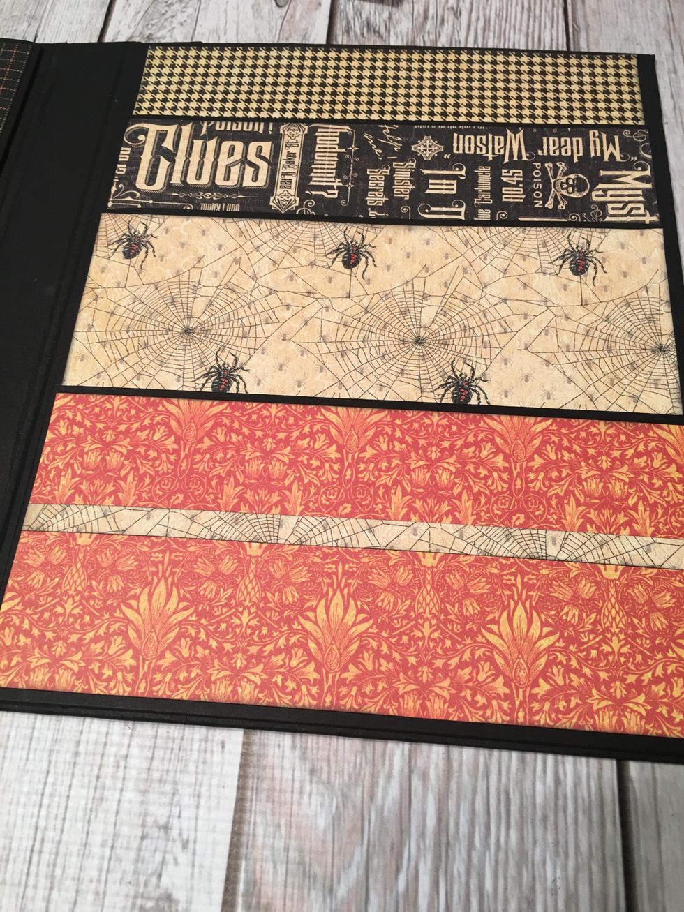 Glue the papers onto each pocket section and also to the very top of the section above the top pocket.  Add strips of paper for trim if desired.