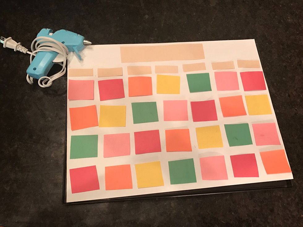 Glue the pieces to the background paper.
