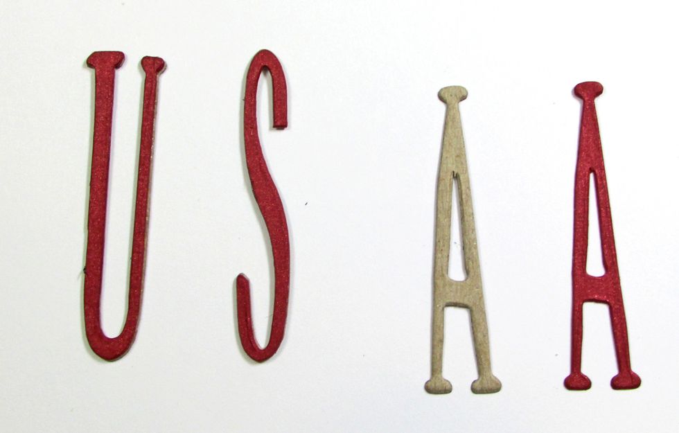 Glue the red cardstock letter to the top of each chipboard letter.