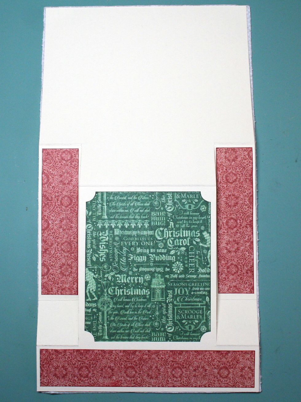 Glue the red strips to the card as shown. The vertical strips are centered on the strip between the fold lines. Omit the green pp if you chose to use a pediment as I did in step 8.