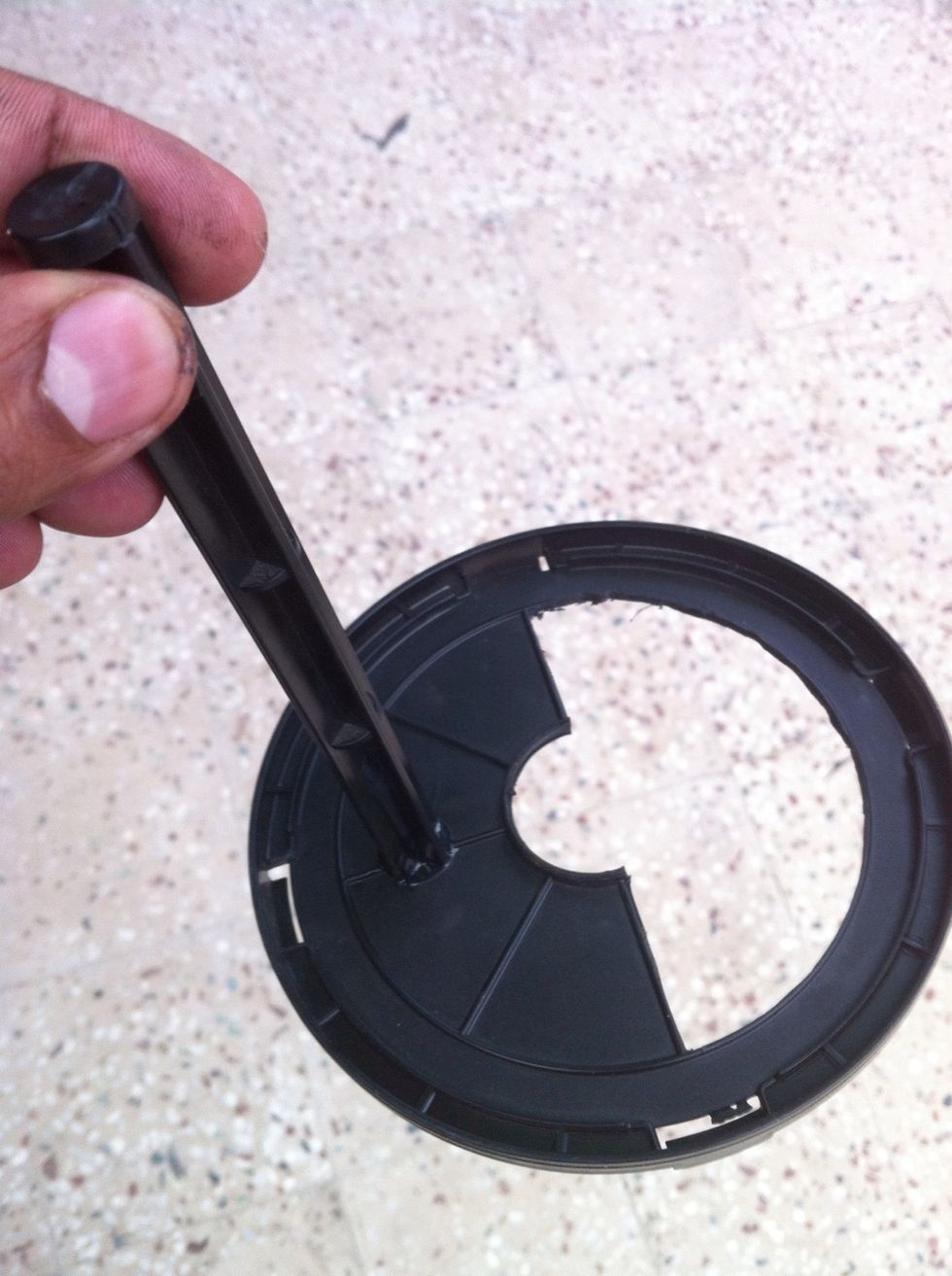 Glue the rod like shown in the picture and let it dry. If you don't have glue, you can use small nut bolts too. Check if it's glued properly and can take a little weight of the bird.