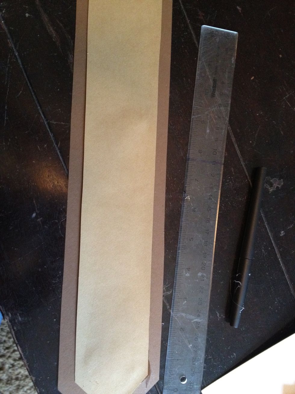 glue the smaller light brown rectangle to the bigger dark brown rectangle and place beneath a heavy object to set.