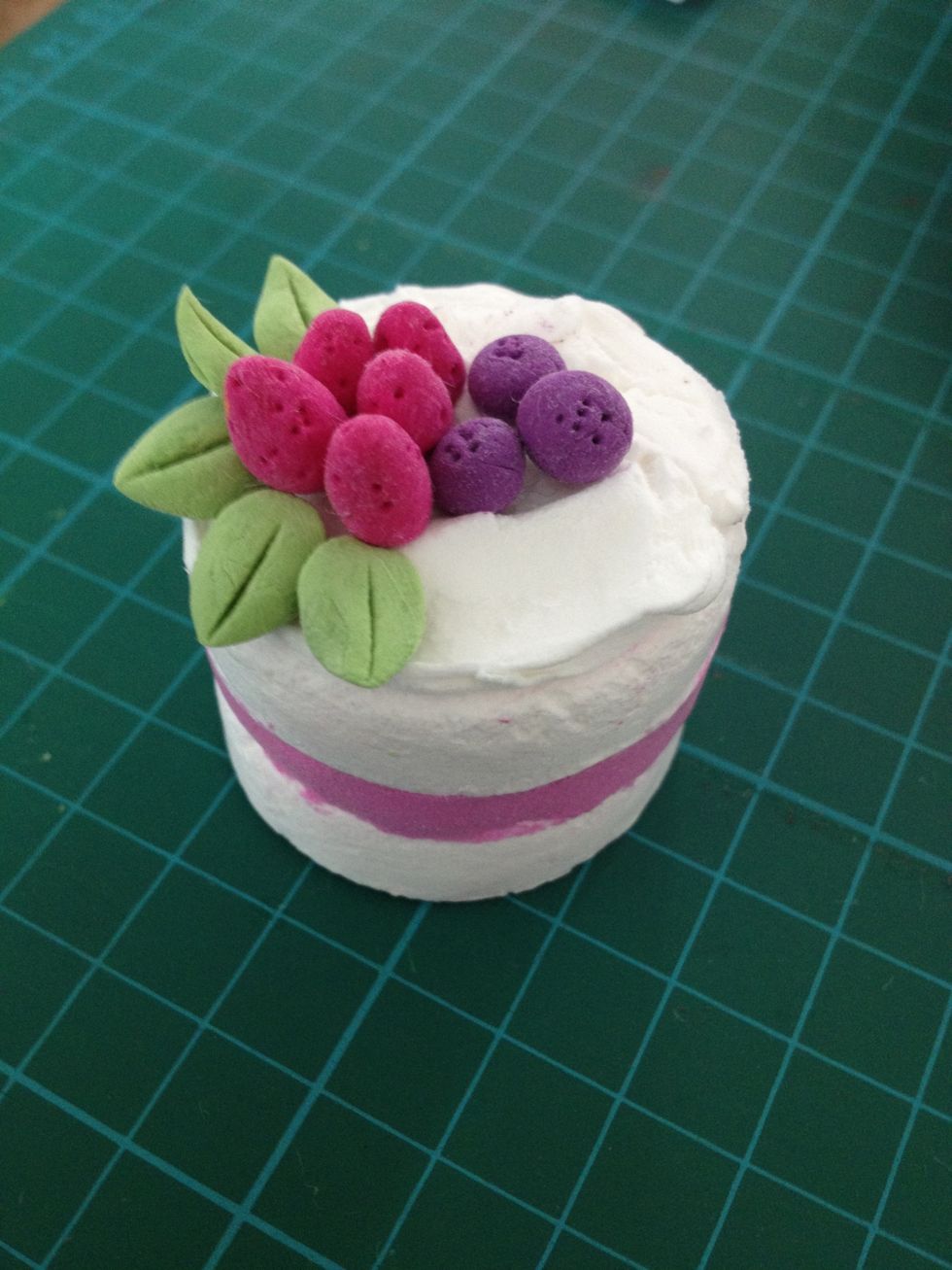 Glue the strawberry, blueberry and leaves on the position you like.