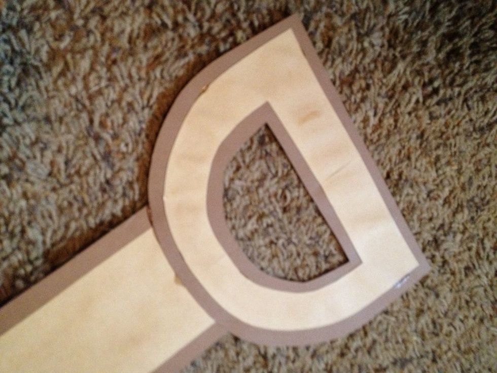 glue the two handles together (light brown on top,) glue to the shaft, and place beneath a heavy object to set.