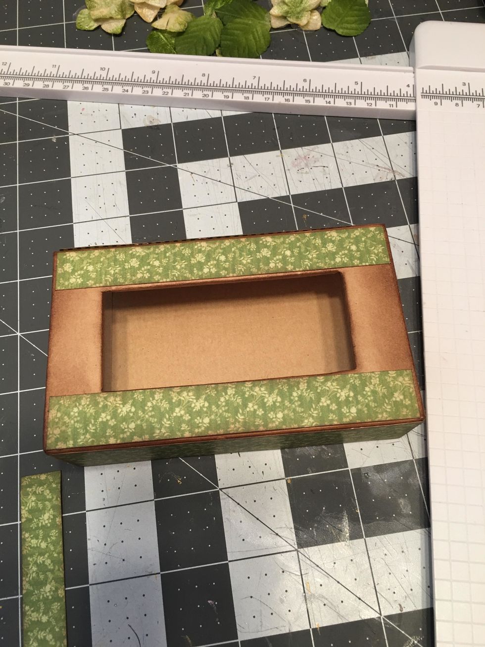 Glue the two longest pieces onto the top of the box.