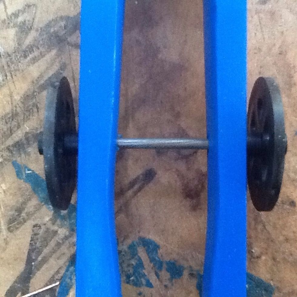 Glue the wheels onto the axel and screw eyelets into the bottom of the car (they will lead the car when racing)