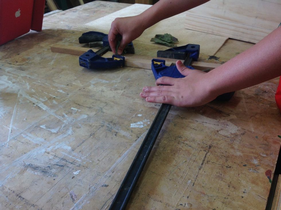 Glue the wood (wiping off any wood that goes on the board) then clamp for 4 hours