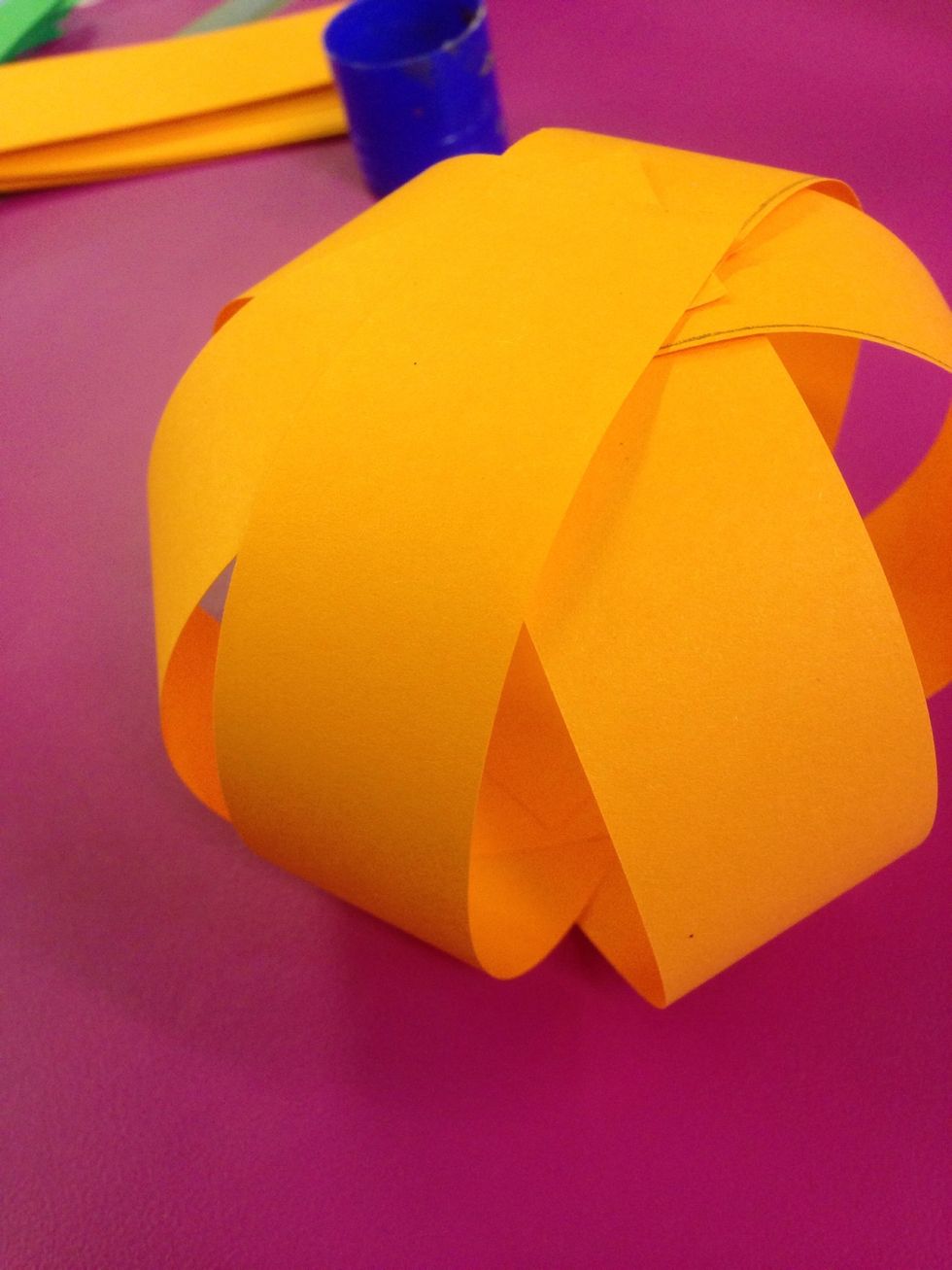 Glue them all the ends together to form a sphere.