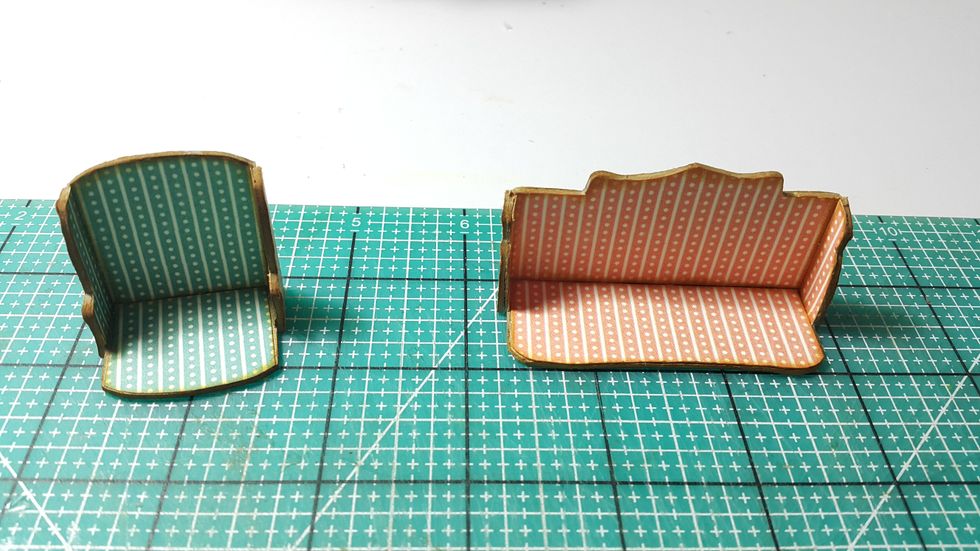 Glue them into shapes and adhere pattern papers on the fronts, color the edges.