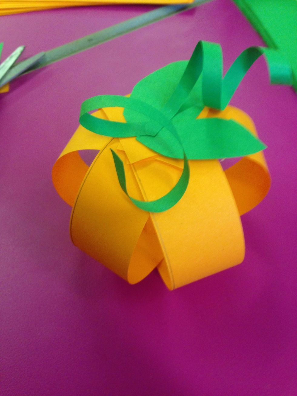 Glue them on to the top of the pumpkin.