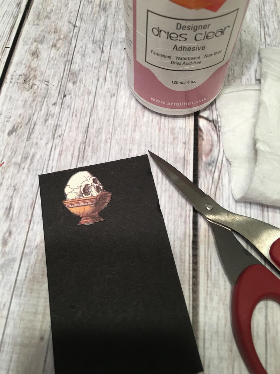 Glue to black card stock and fussy cut out again.  This will become a pull tab and needs the extra thickness.