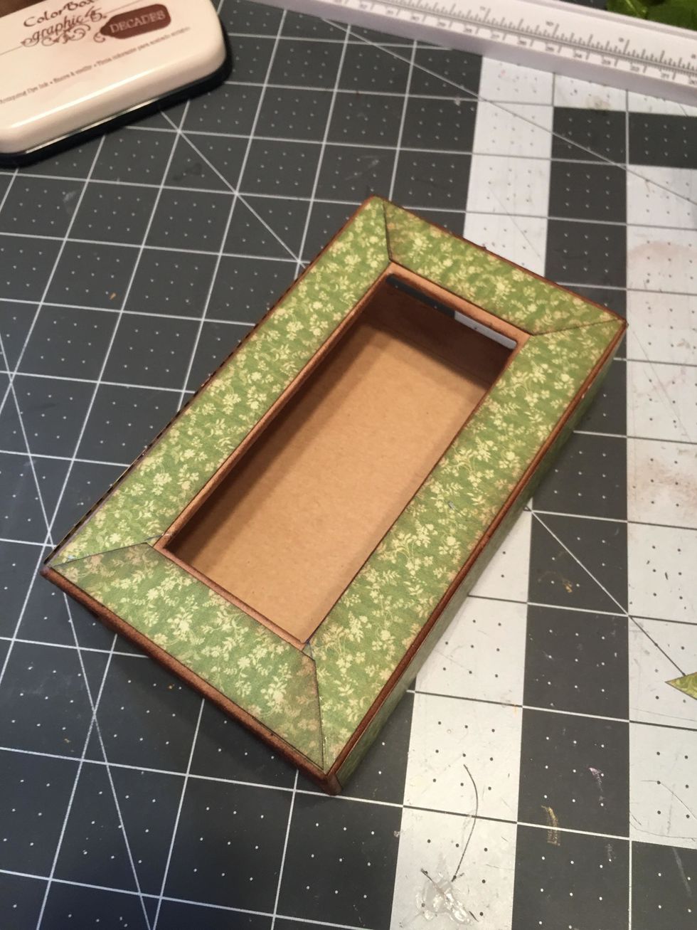 Glue to the top of the box so it appears to be mitered.