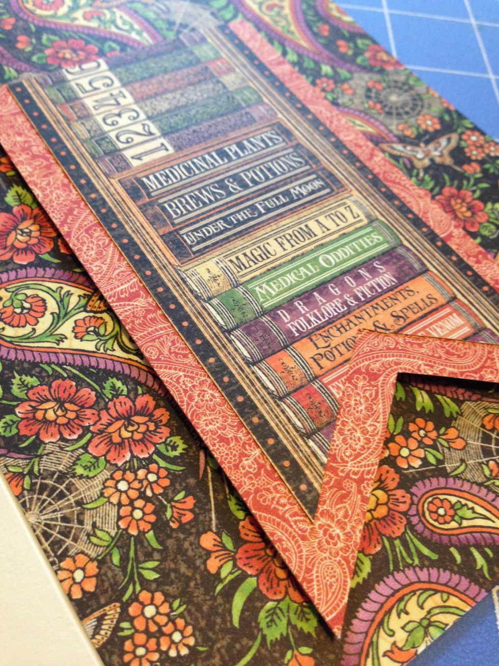 Glue together the two flags so that they stagger, and adhere the flag to the card front on pop dots. Set aside.