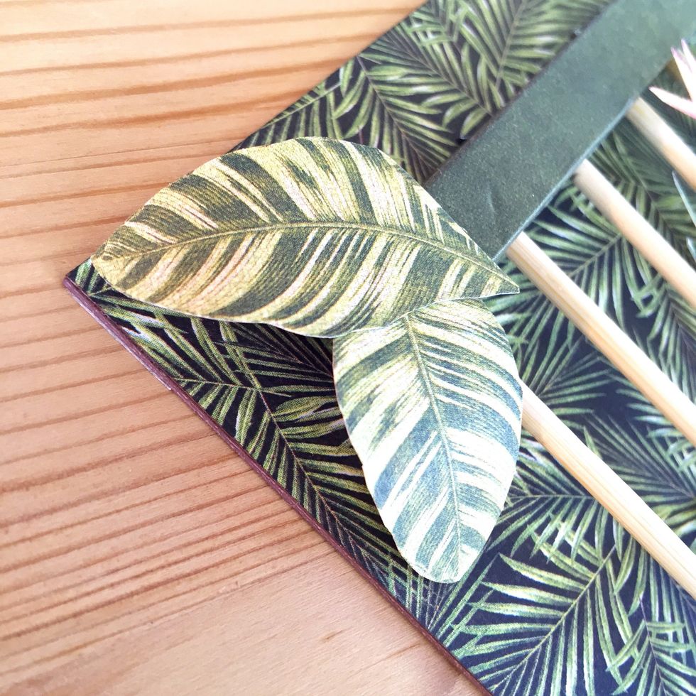 Glue two leaves on left corner.