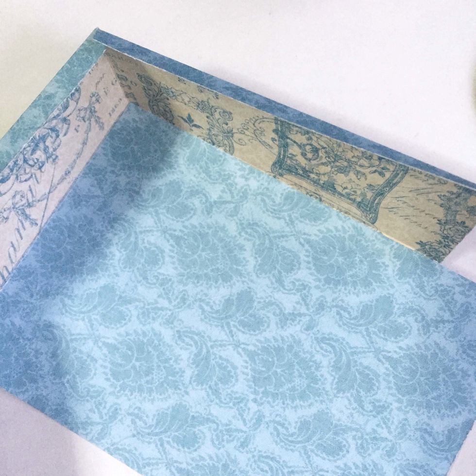 Glue under the pattern paper as shown. Repeat on the other side.