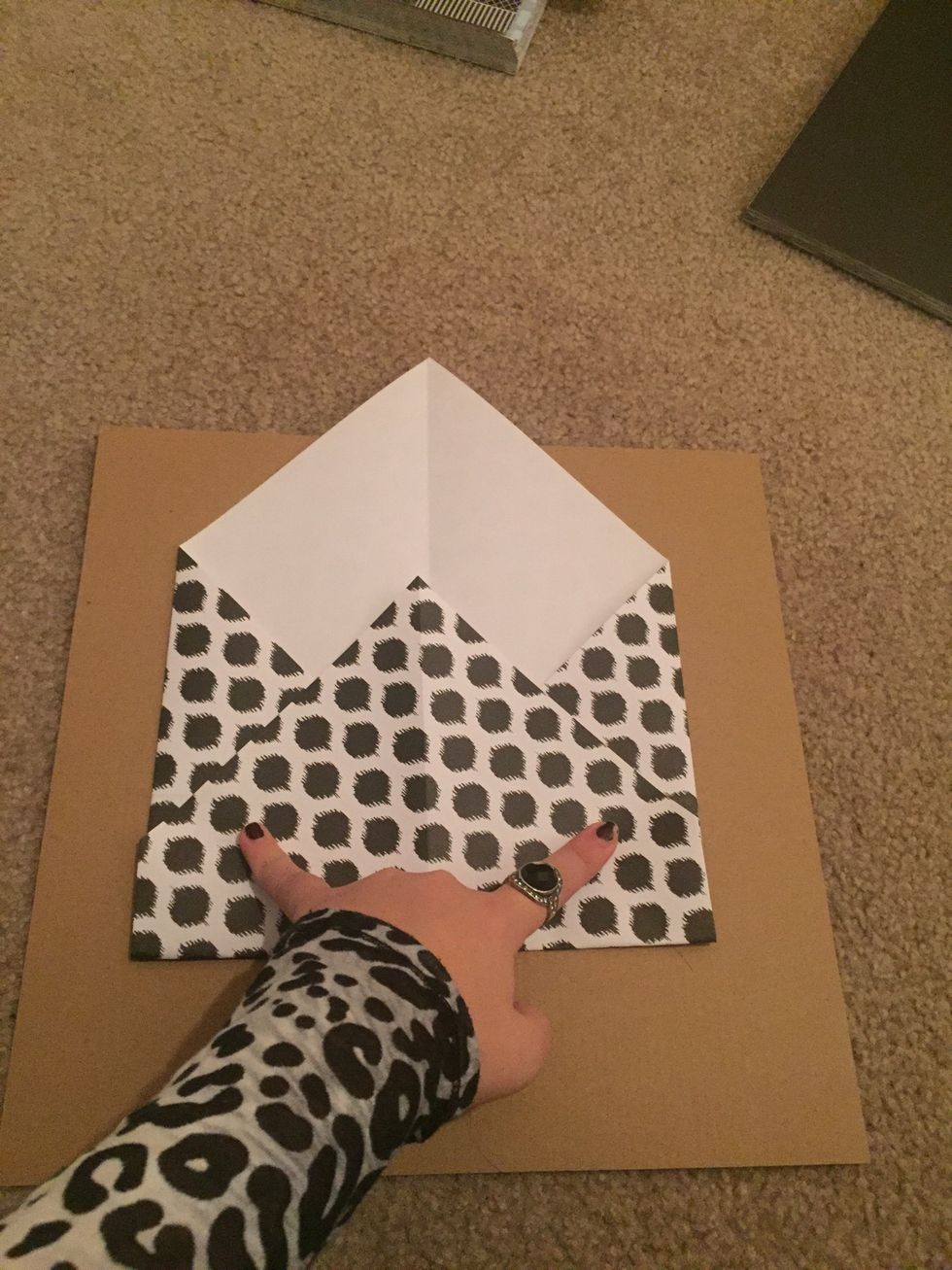 Glue underneath the flap where I am pointing to in the photo. This will keep your envelope together.