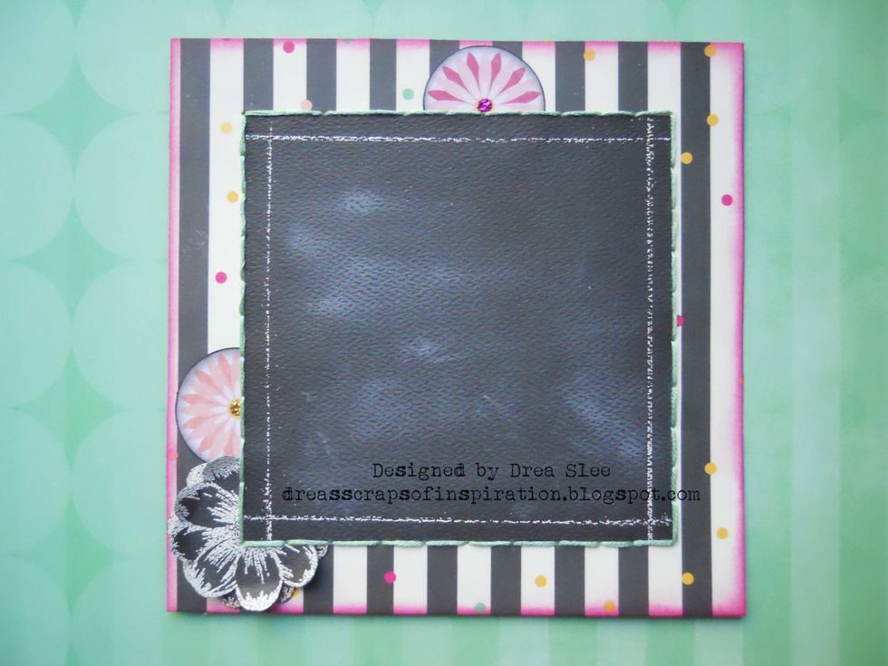 Glue your "chalkboard" to the center of the striped paper, and hand stitch around the edges.