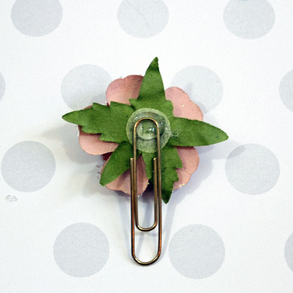 Glue your clip to the back of the flower.