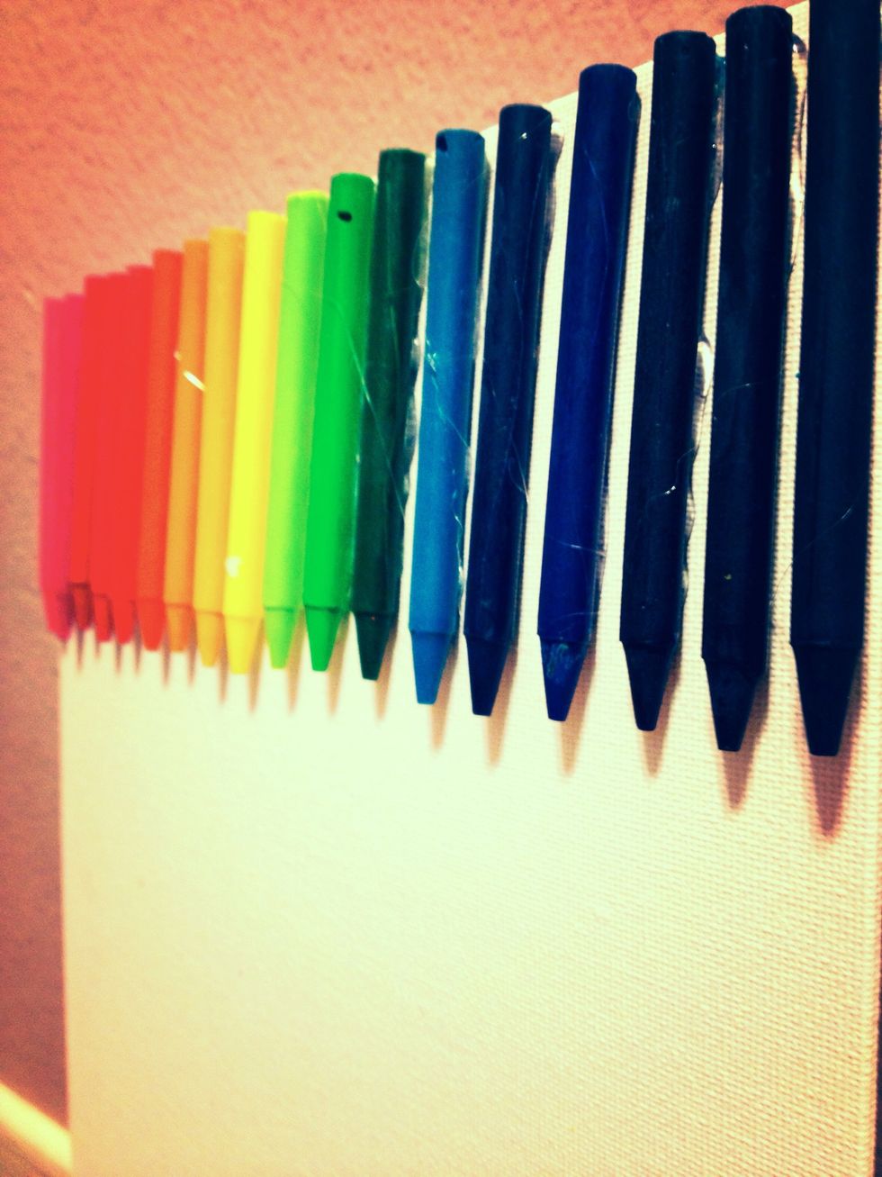Glue your crayons on. Space them out 1/4 of an inch.