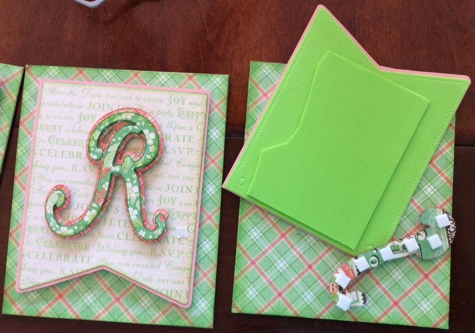 Glue your letter on the front banner, add double thick foam to raise your banner shape from the bottom rectangular shape.