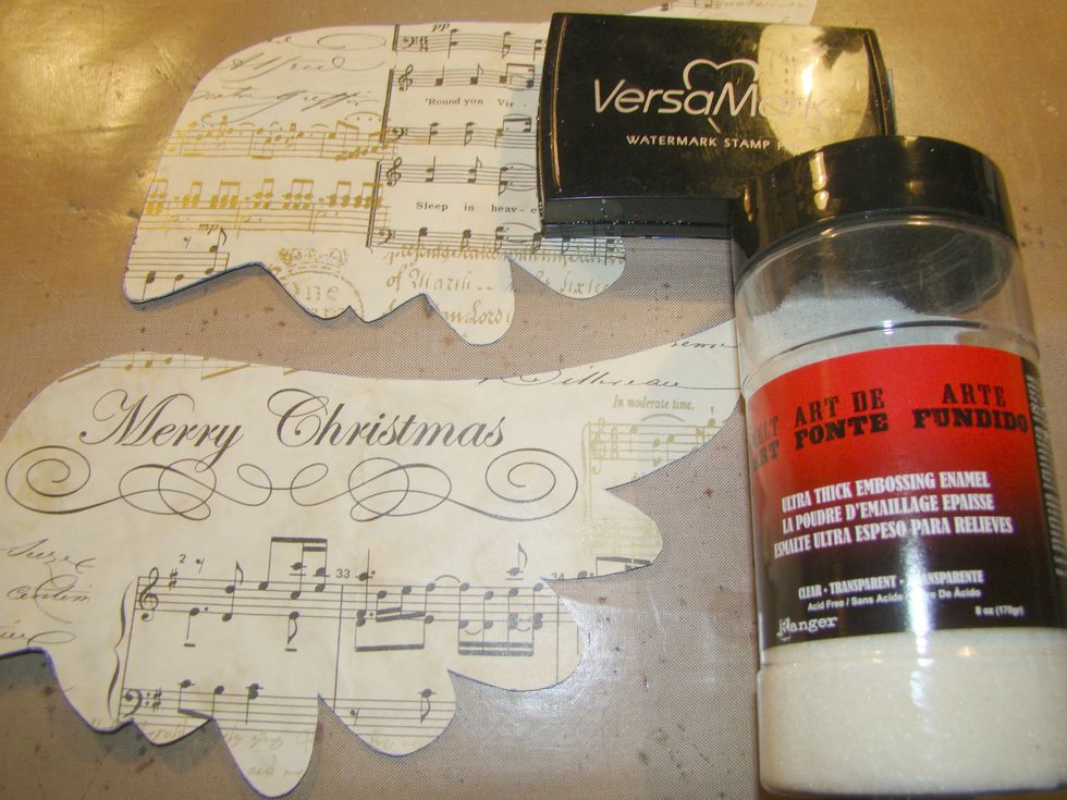Glue your scrapbook paper to the wings. This is actually Christmas paper from last year. Stamp Vesamark on entire wing and apply your UTEE and heat to emboss.