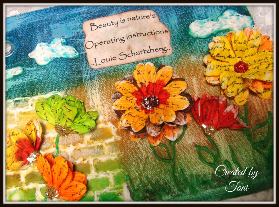 Glue your sentiment on and use the hot glue gun to apply your pretty flowers. I dry brushed the flowers a bit with white acrylic paint for added texture and interest.