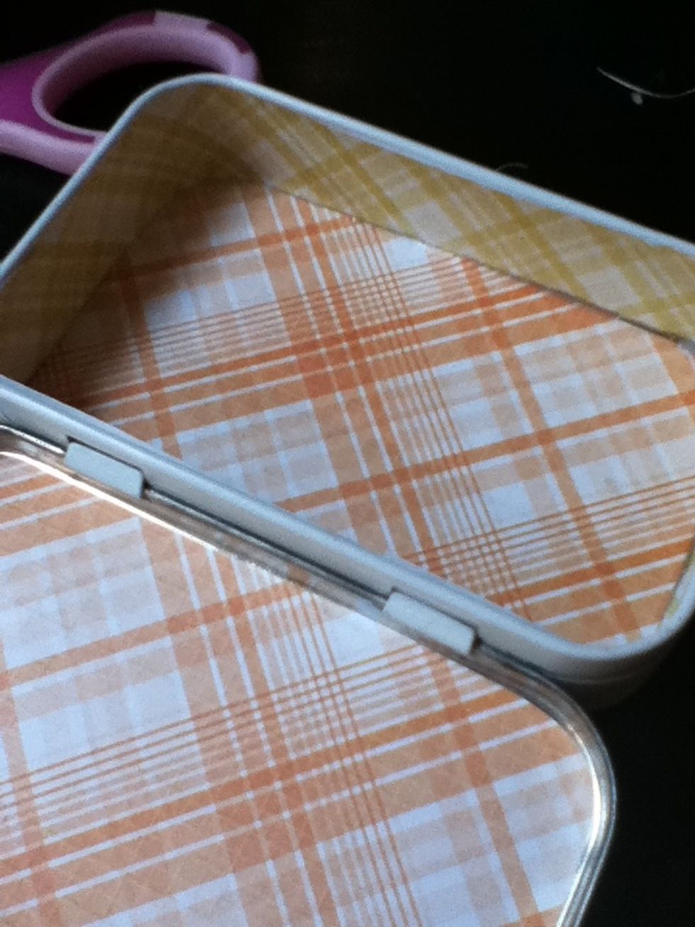 Glue your strip to the wall of your tin.