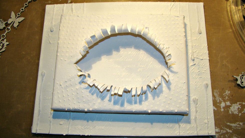 Glue your two canvases together.