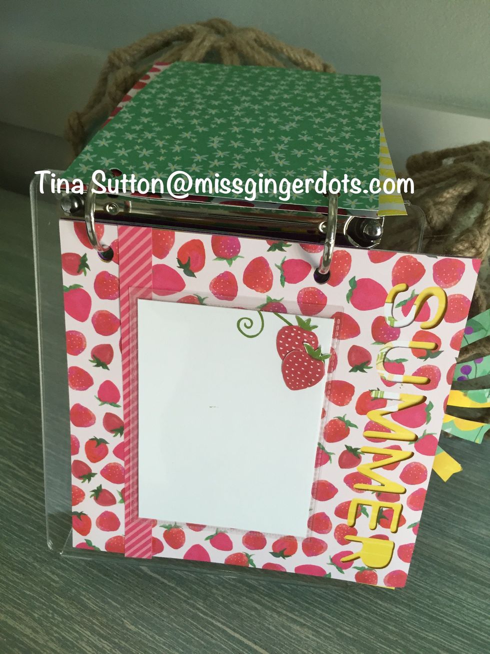 Glue zip strip to strawberry paper. Add recipe or photo to 3 x 4 card. On 3 x 4 card stamp part of vine.  Stamp 2 strawberries on extra white paper.  Cut out and glue on card.  Insert in flip flap.