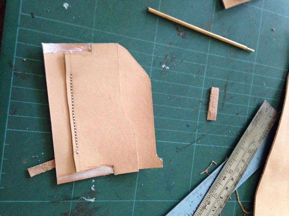 Glued them to the biggest part of the leather, do this on both side