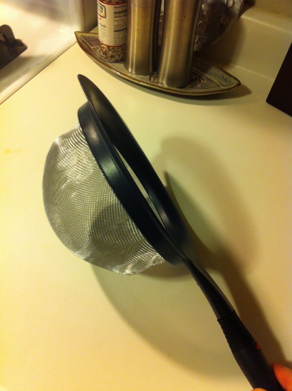 Go ahead and get your mesh strainer ready. Once the coffee is done roasting, you'll need it right away, so keep it handy.