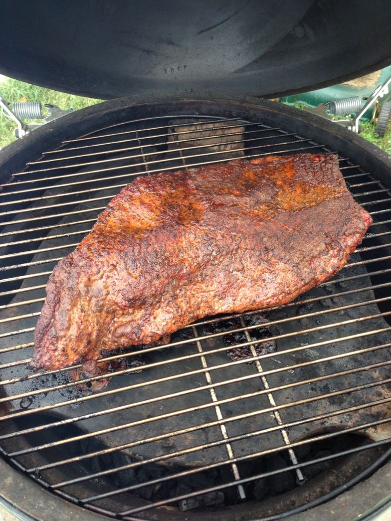 https://guides.brit.co/media-library/go-ahead-and-open-the-grill-dome-for-the-first-time-to-pull-the-meat-to-wrap-it-in-foil-or-butcher-paper.jpg?id=23641642&width=784&quality=85