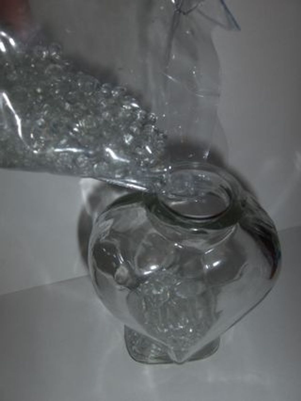 Go ahead and prepare the vase by pouring the glass beads into the vase (like water :-). )