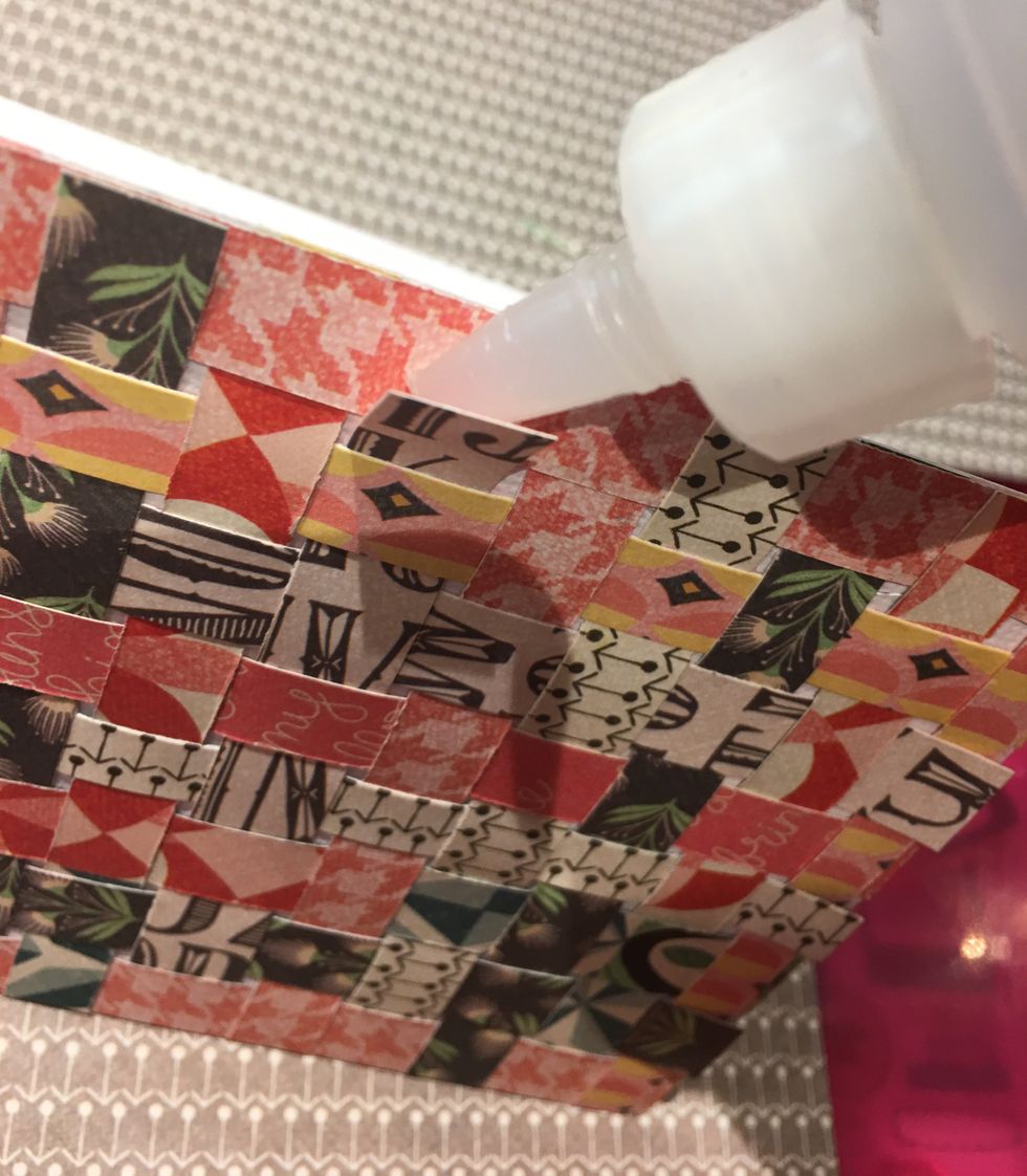 Go around the edges and glue down any strips that are loose. You want everything completely glued down to the card base.