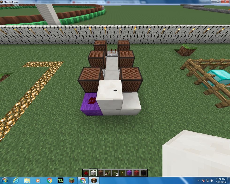Go back to the front and place a block of Quartz on top of the front middle Quartz block.